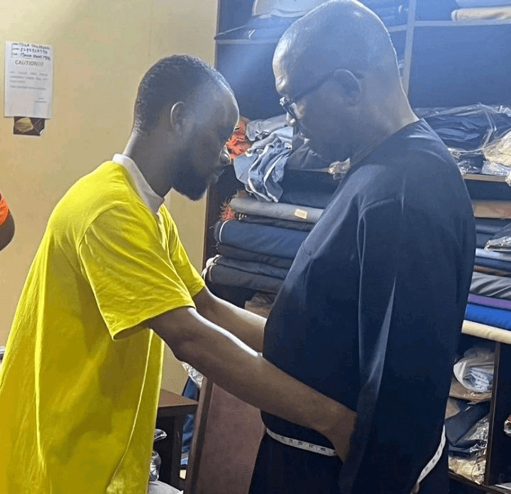 Photo of Peter Obi Having His Measurements Taken by a Man Triggers Mixed Reactions Online