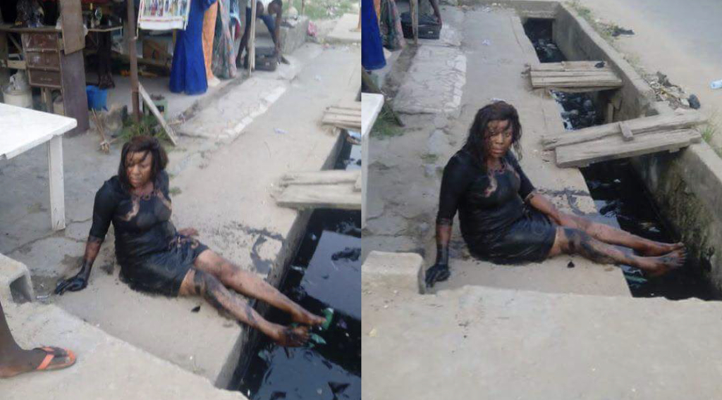Nigerian Lady Who Wore A High Heel Shoe while going out Falls Inside Gutter (Watch)