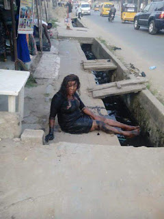 Nigerian Lady Who Wore A High Heel Shoe while going out Falls Inside Gutter (Watch)