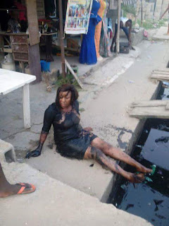 Nigerian Lady Who Wore A High Heel Shoe while going out Falls Inside Gutter (Watch)